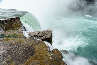 Scenic view of niagara falls against sky