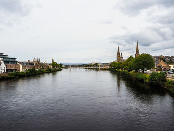 Bridge over river against sky