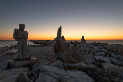 Scenic view of sea against clear sky during sunset