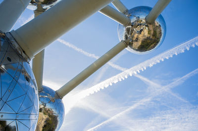 Low angle view of vapor trail against blue sky