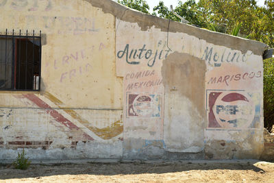 Graffiti on wall of old building