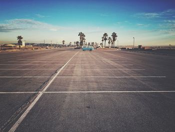 Parking area at huntington state beach against sky