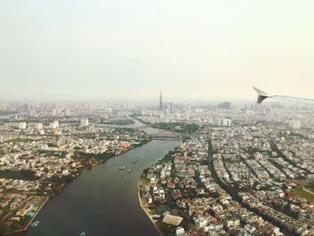 High angle view of city buildings against sky