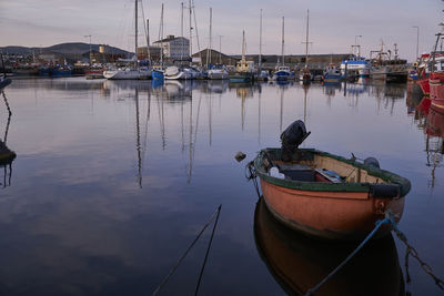 Boats moored at harbor