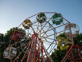 Low angle view of ferris wheel against clear sky