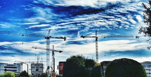 Construction site against cloudy sky