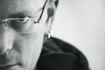 Close-up portrait of man wearing eyeglasses