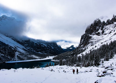 Scenic view of snow covered mountains against sky