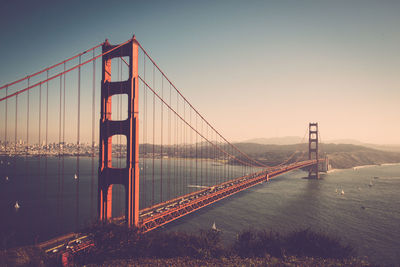 Golden gate bridge over bay against sky