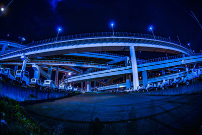 Illuminated bridge against sky in city at night