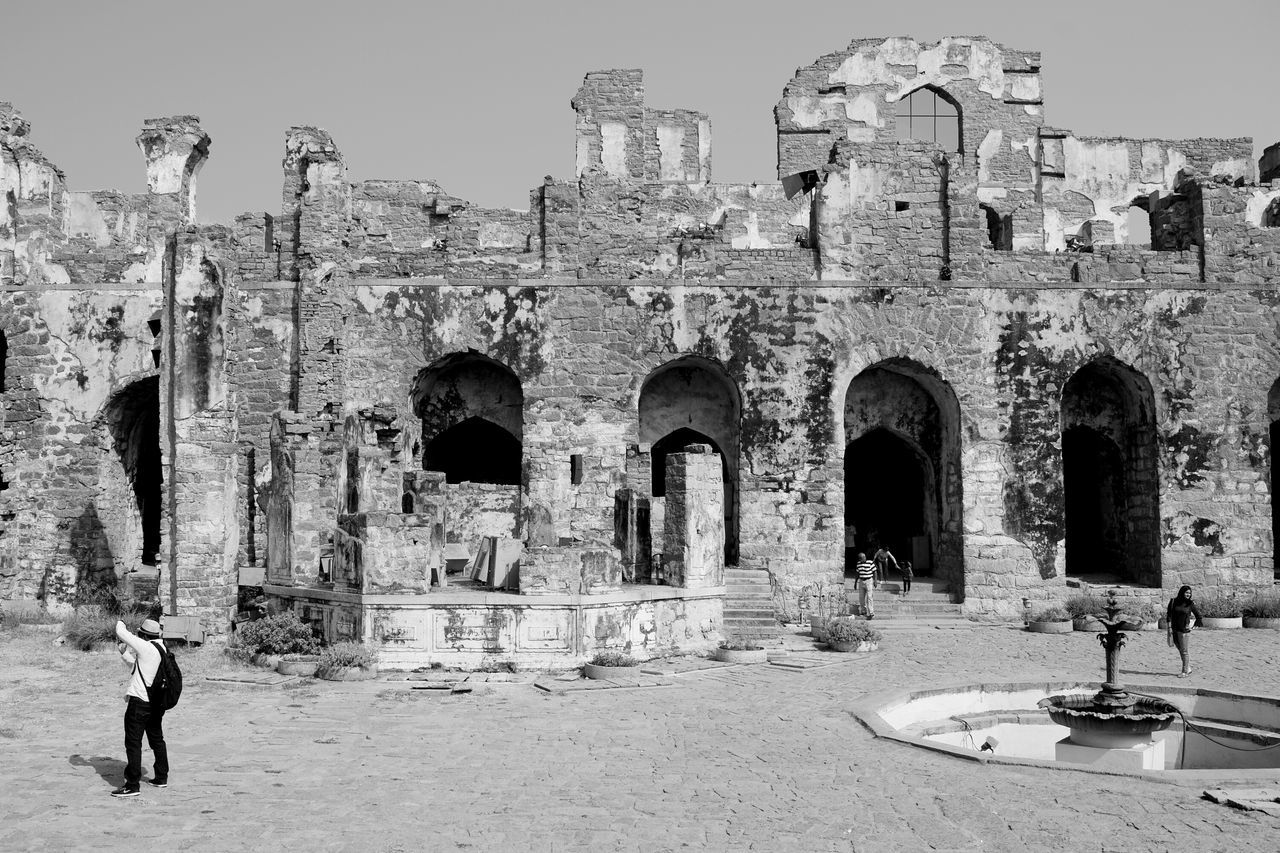 old ruin, architecture, history, built structure, ancient, the past, arch, ancient civilization, building exterior, tourism, travel destinations, damaged, bad condition, archaeology, travel, real people, day, outdoors, men, sky, people