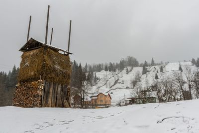 Panoramic view of houses on snow covered landscape