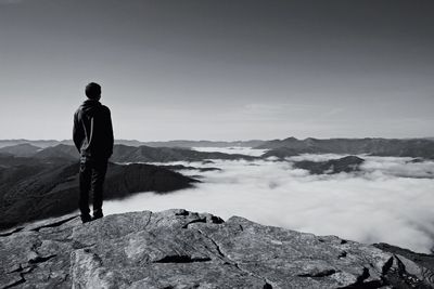 Aerial view of man standing on rock