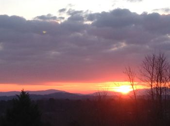 Scenic view of silhouette landscape against sky during sunset