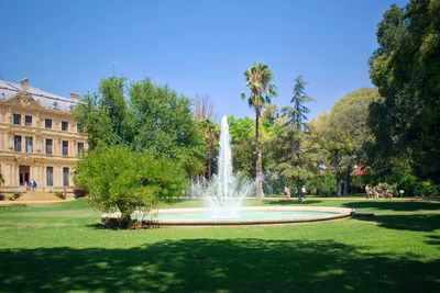 Fountain in park against sky
