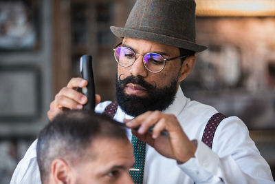 Portrait of man holding camera