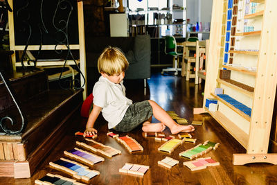 Boy playing with toy at home