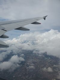 Aerial view of airplane flying in sky