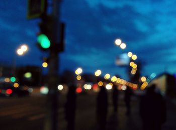 Defocused image of illuminated city at night