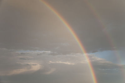 Low angle view of rainbow against sky