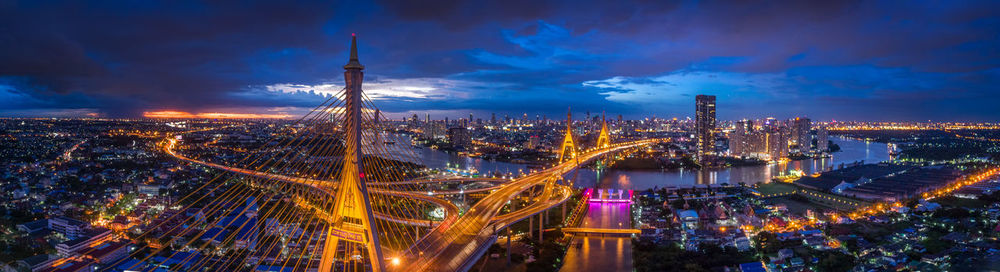 High angle view of city lit up at night