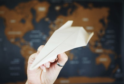 Close-up of human hand on paper