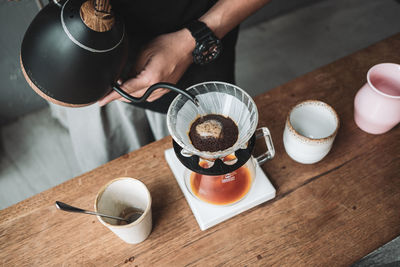 Barista dripping coffee and slow coffee bar style