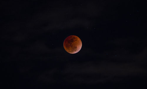 Low angle view of moon against sky at night