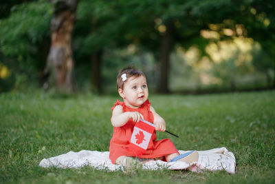 Girl sitting on field