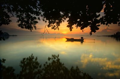 Scenic view of lake against sky during sunset