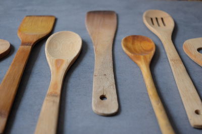 Close-up of wooden spoons and spatula on table