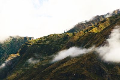 Scenic view of waterfall against sky