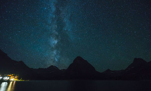 Scenic view of lake against star field at night