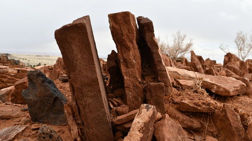 Rock formation on land against sky