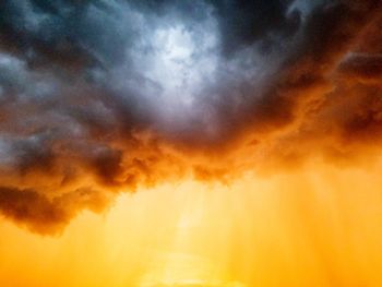 Low angle view of dramatic sky during sunset