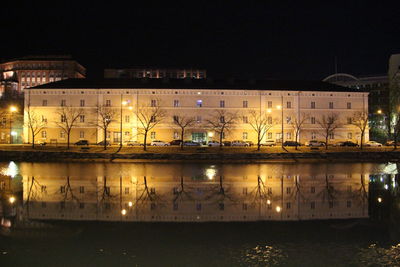 Illuminated tunnel at night