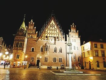 View of buildings in city at night