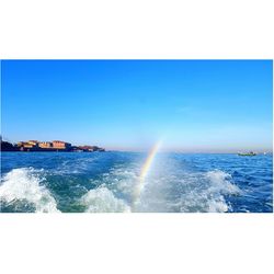 Scenic view of sea against clear blue sky