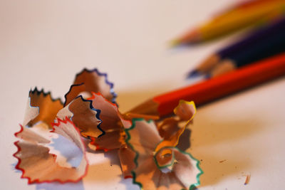 Close-up of multi colored pencils on table