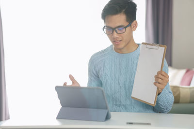 Young man using mobile phone