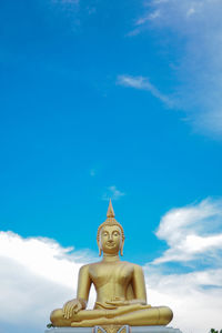 Low angle view of statue against blue sky