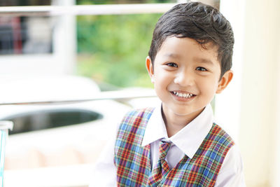 Portrait of cute boy smiling