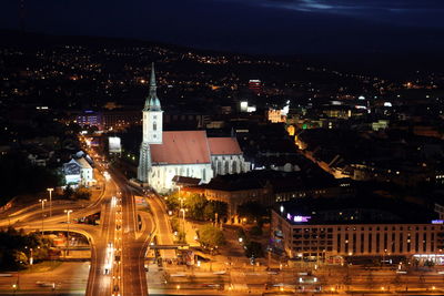 High angle view of road along built structures at night