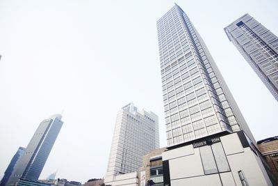 Low angle view of modern buildings against clear sky