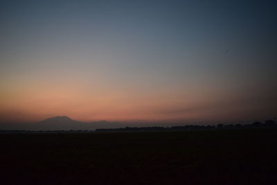 Scenic view of silhouette landscape against sky during sunset