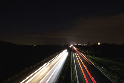 Light trails on road at night