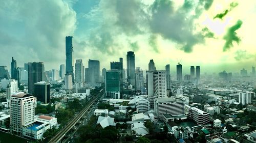 High angle view of modern buildings in city against sky