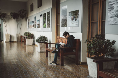 Man sitting on chair in building