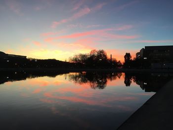 Scenic view of lake against sky during sunset