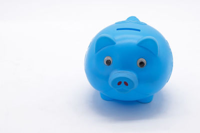 Close-up of blue toy over white background